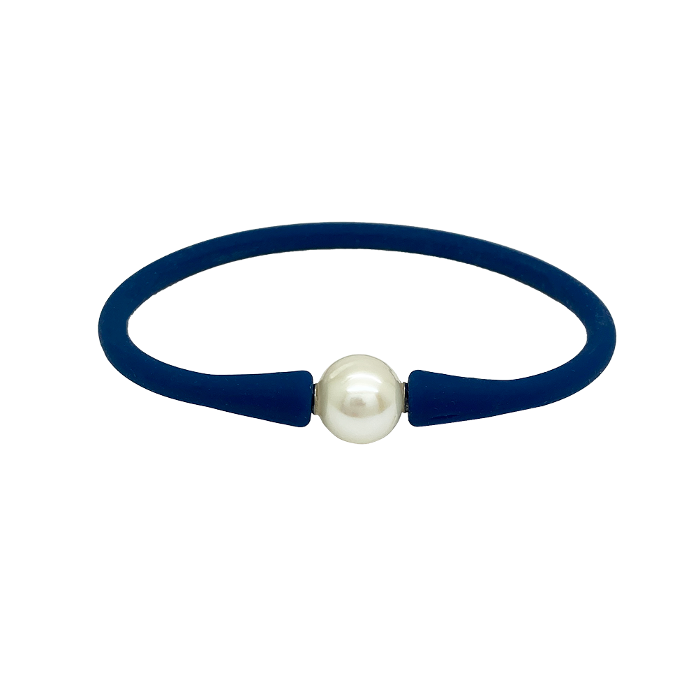 Bracelet with a single white pearl in the center. The bracelet is made of a rubber-like material .