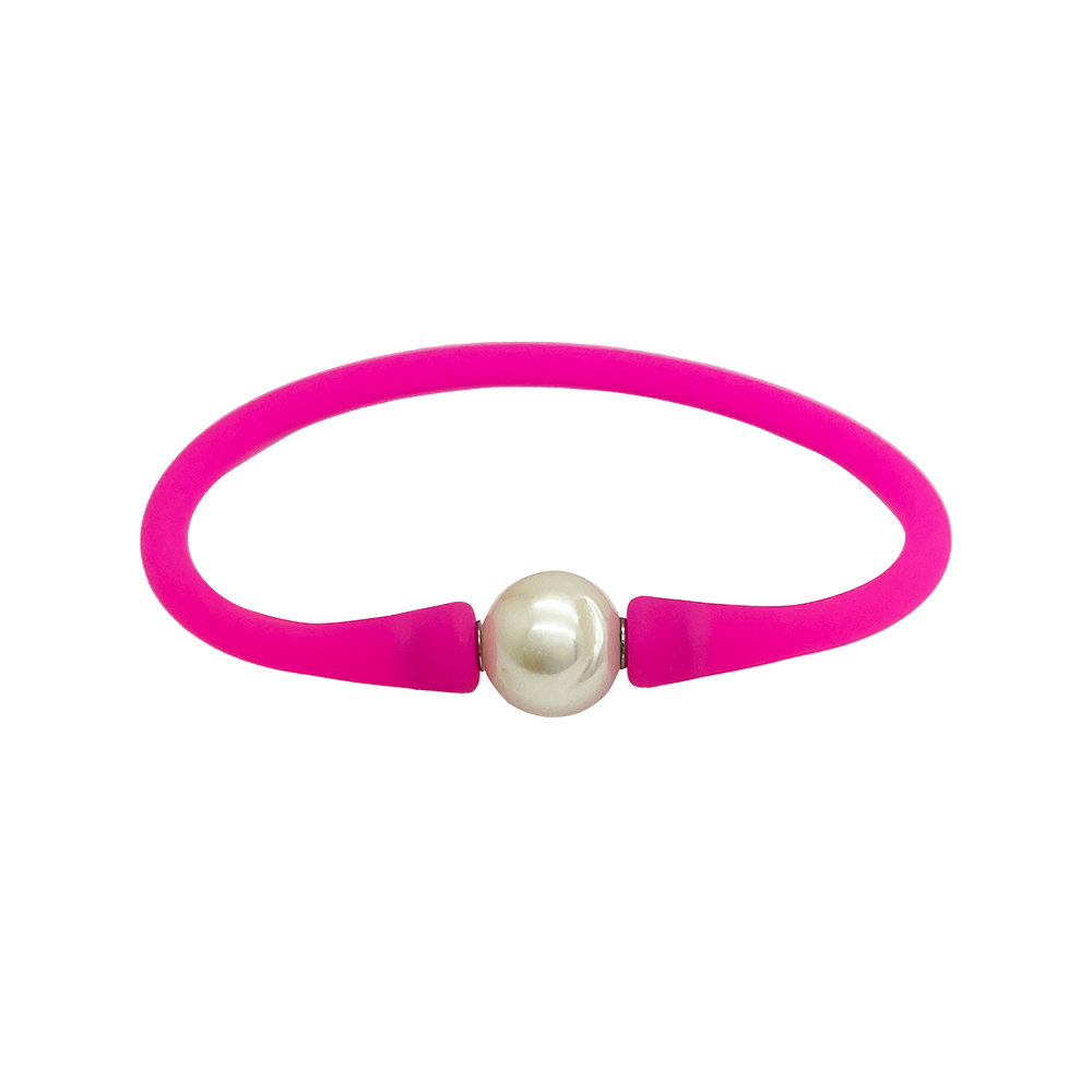Bracelet with a single white pearl in the center. The bracelet is made of a rubber-like material .