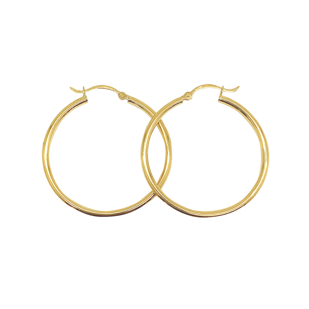 Gold hoop earrings on a white background