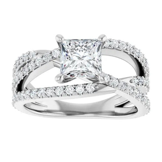 Diamond ring with a central princess-cut diamond and smaller diamonds on the band against a white background