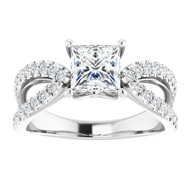 Silver ring with a princess-cut diamond and smaller diamonds on a white background