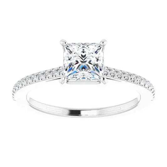Diamond ring with a princess-cut center stone on a white background