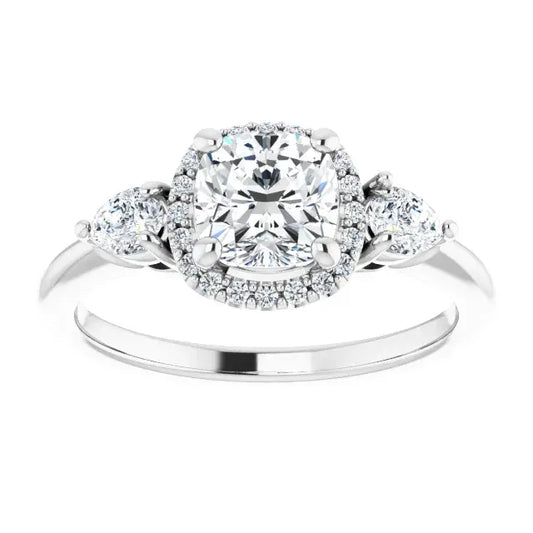 Silver ring with a large central diamond and smaller diamonds on the sides against a white background