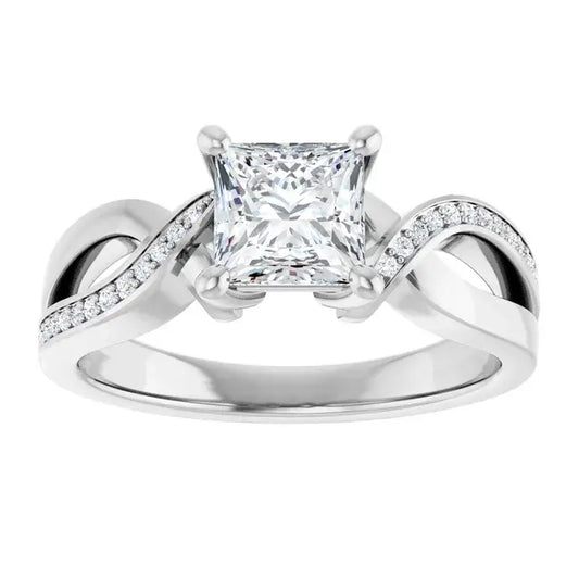 Silver ring with a prominent diamond on a white background