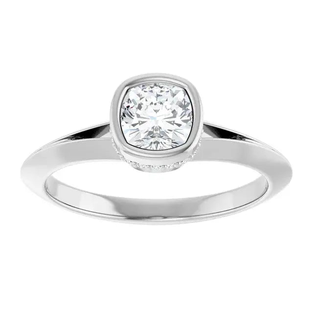 Silver ring with a diamond on a white background