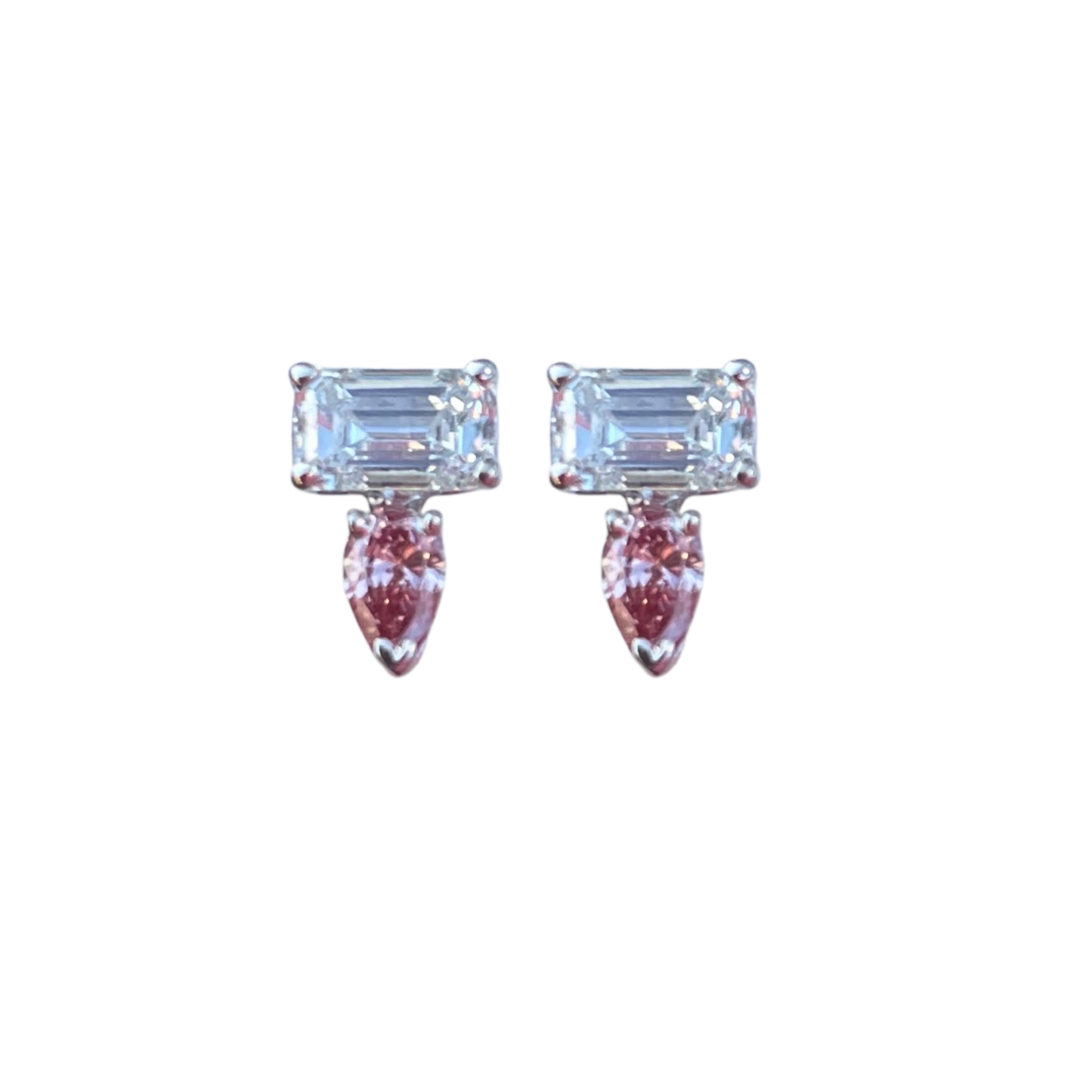 Pair of earrings with rectangular gemstones and pink accents on a white background