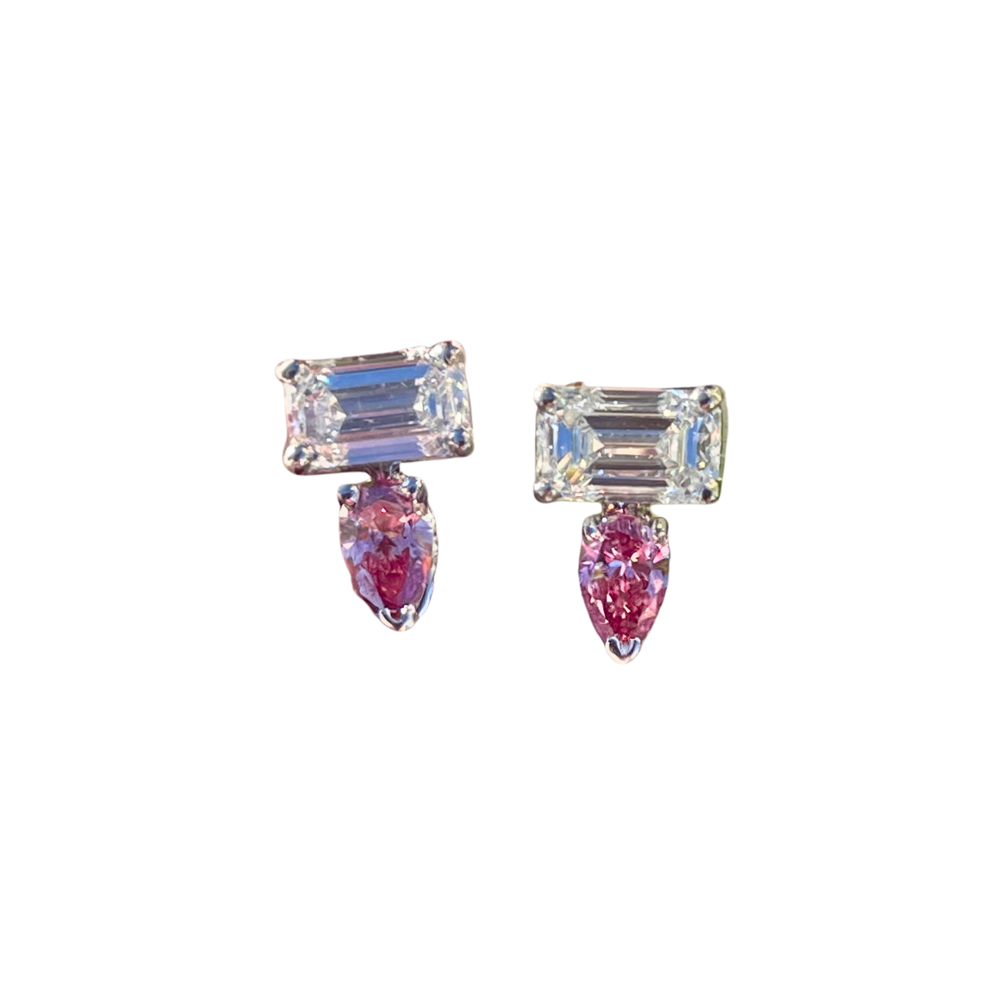Pair of earrings with rectangular and teardrop-shaped gemstones on a white background