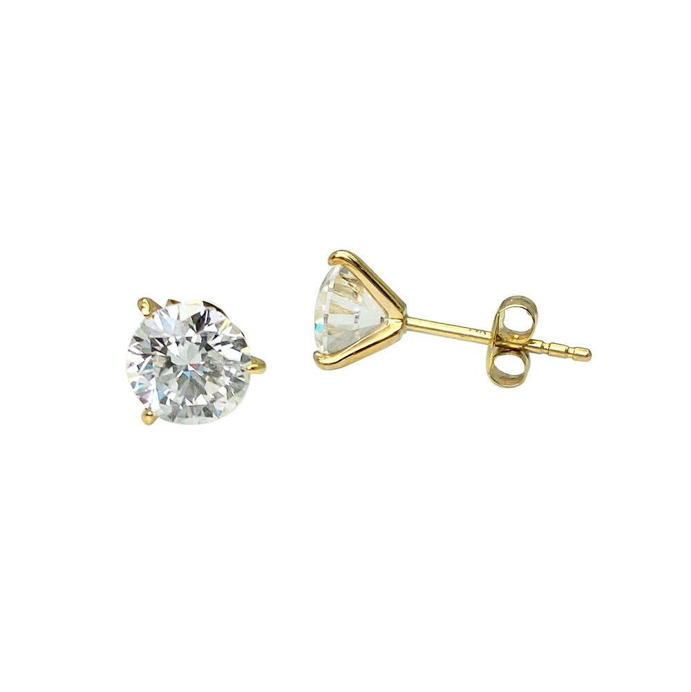Pair of yellow gold single diamond stud earrings on a white background