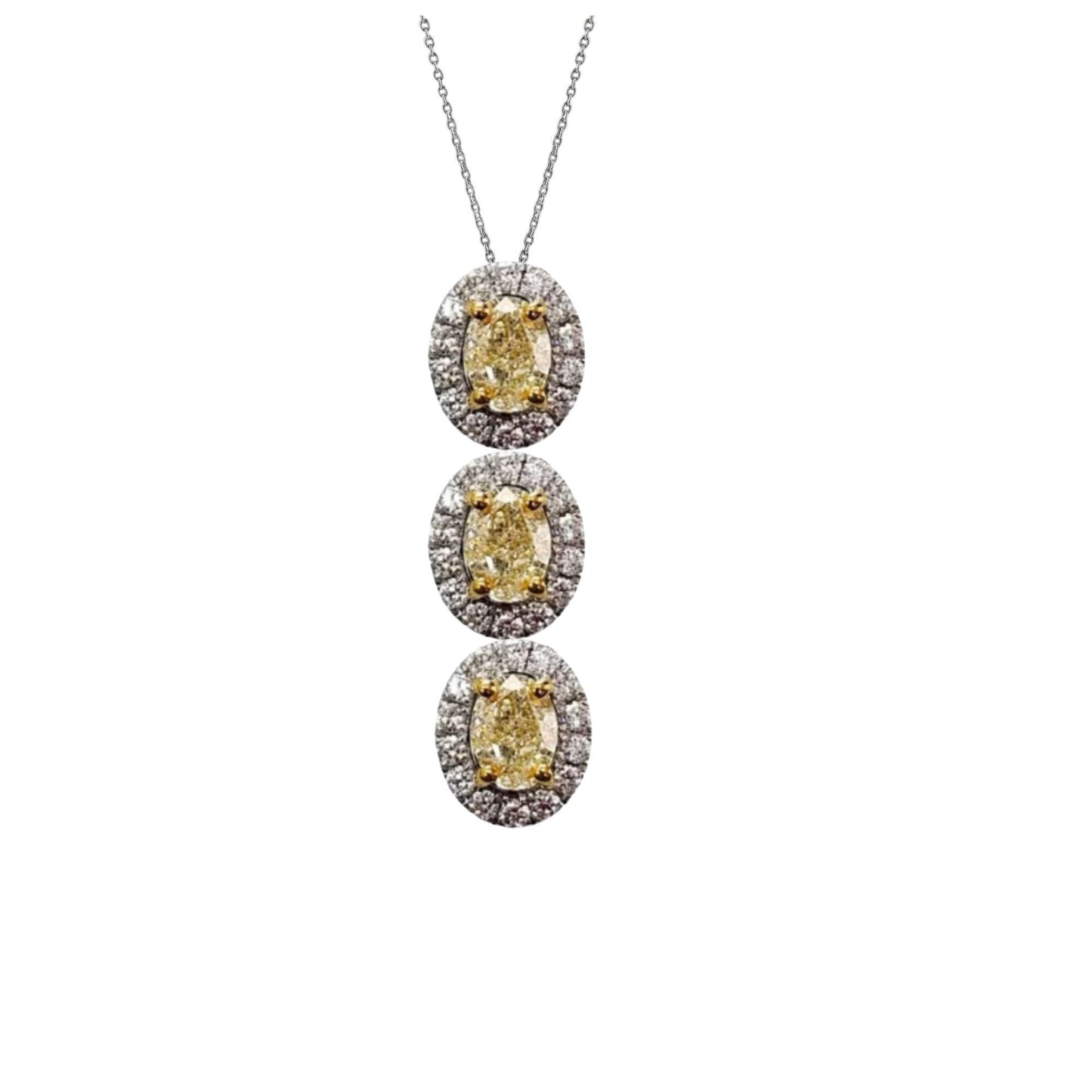 Three-tiered diamond necklace with yellow gemstones on a white background
