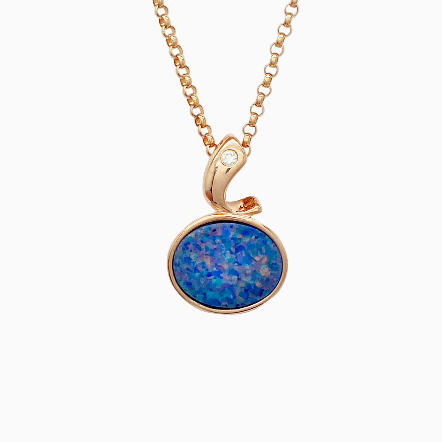Rose gold necklace with a blue opal pendant on a white background
