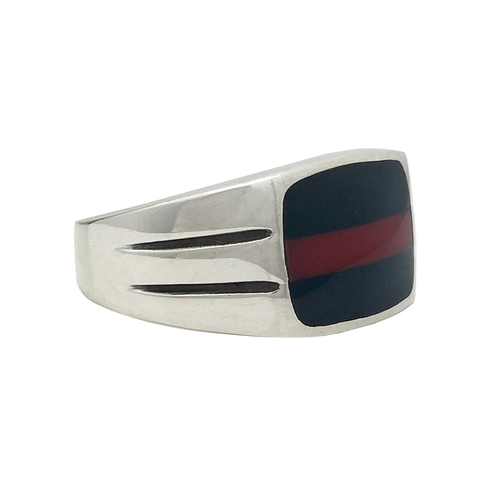 Silver ring with a black and red inlay on a white background