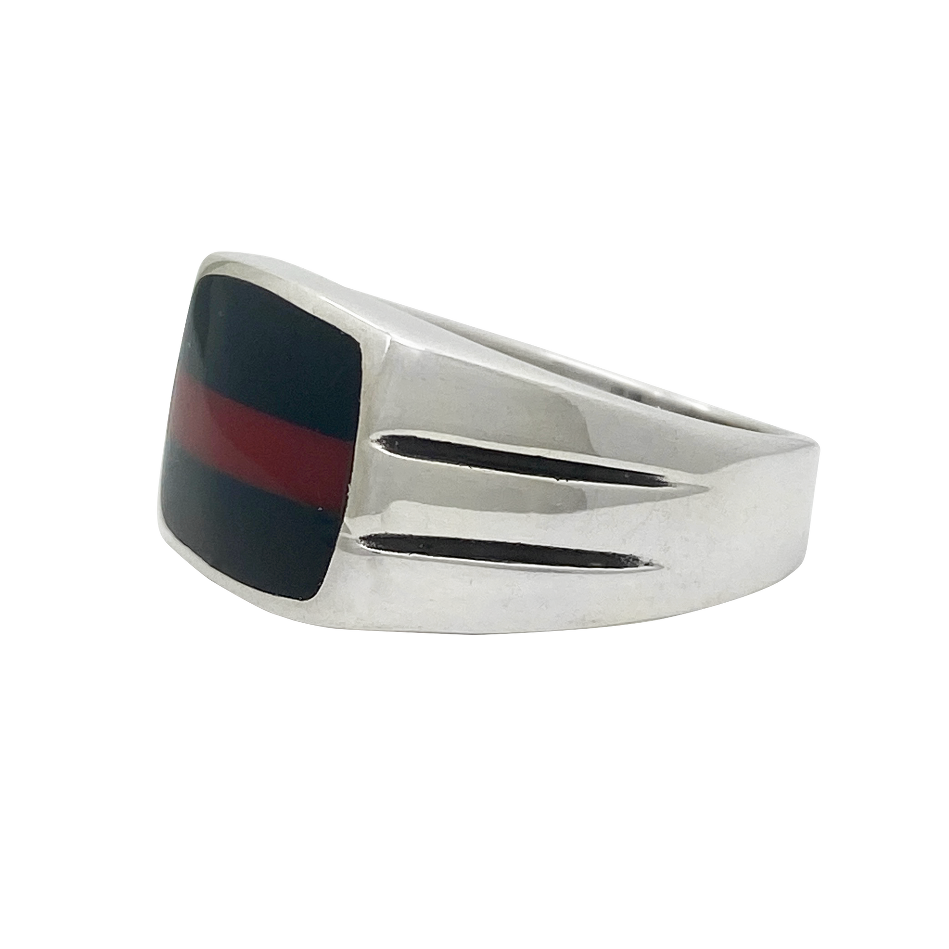 Silver ring with a black and red inlay on a white background