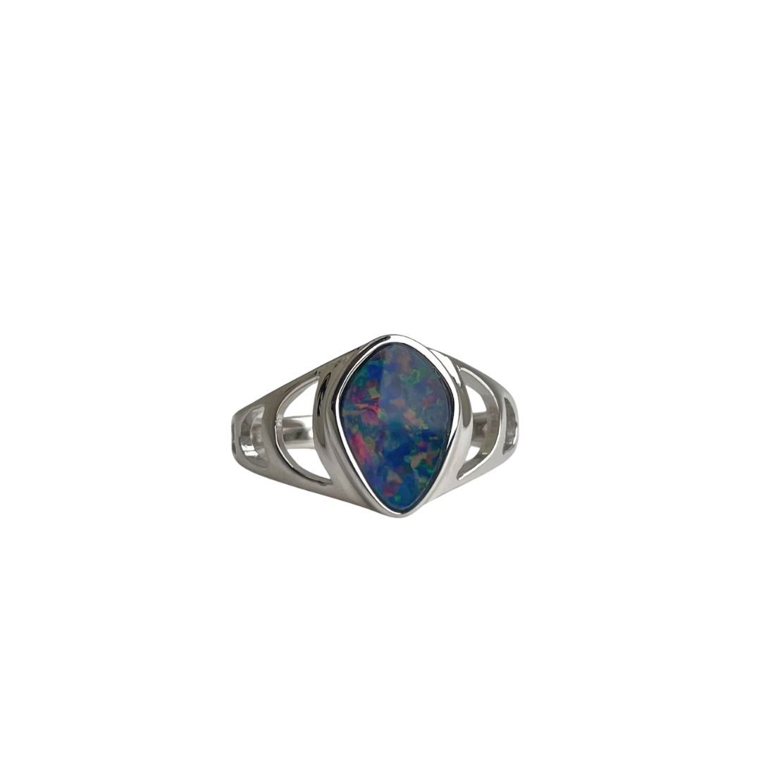 Silver ring with a colorful stone on a white background