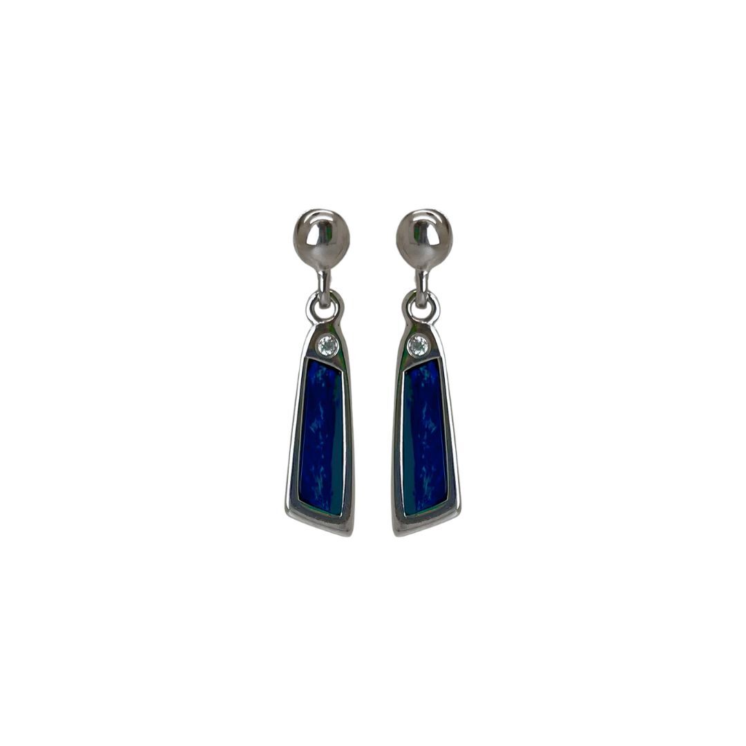 Pair of silver earrings with blue stones on a white background