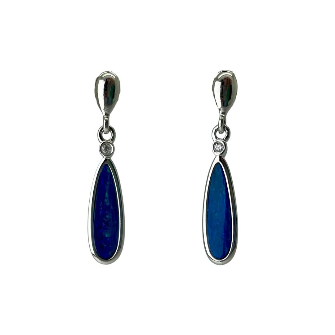 Pair of blue teardrop earrings with silver accents on a white background