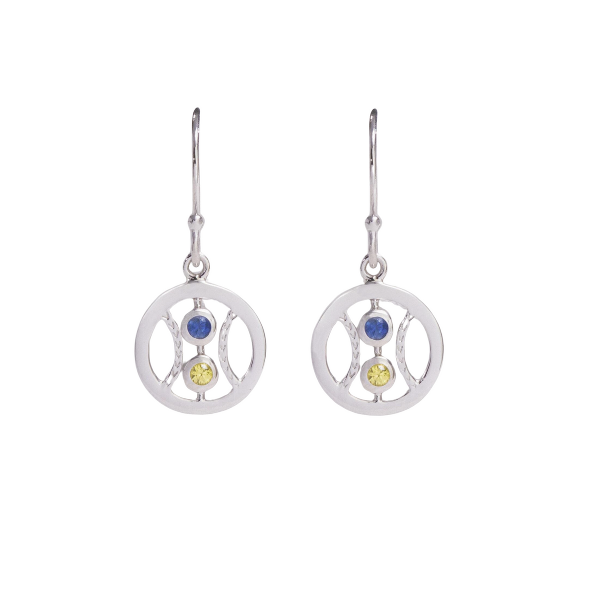 Pair of silver earrings with circular designs and colored stones on a white background