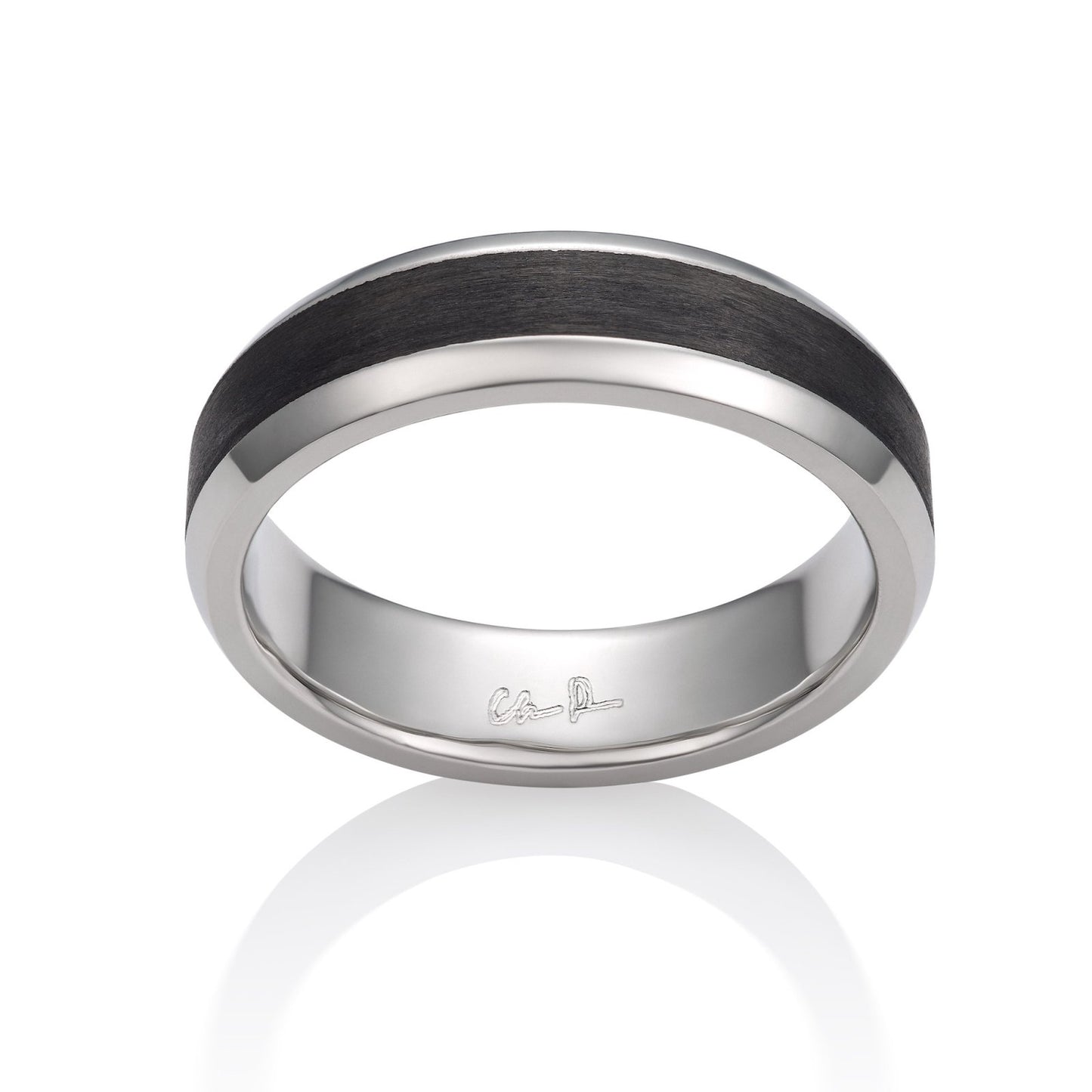 White gold ring with a black carbon fiber inlay on a white background.