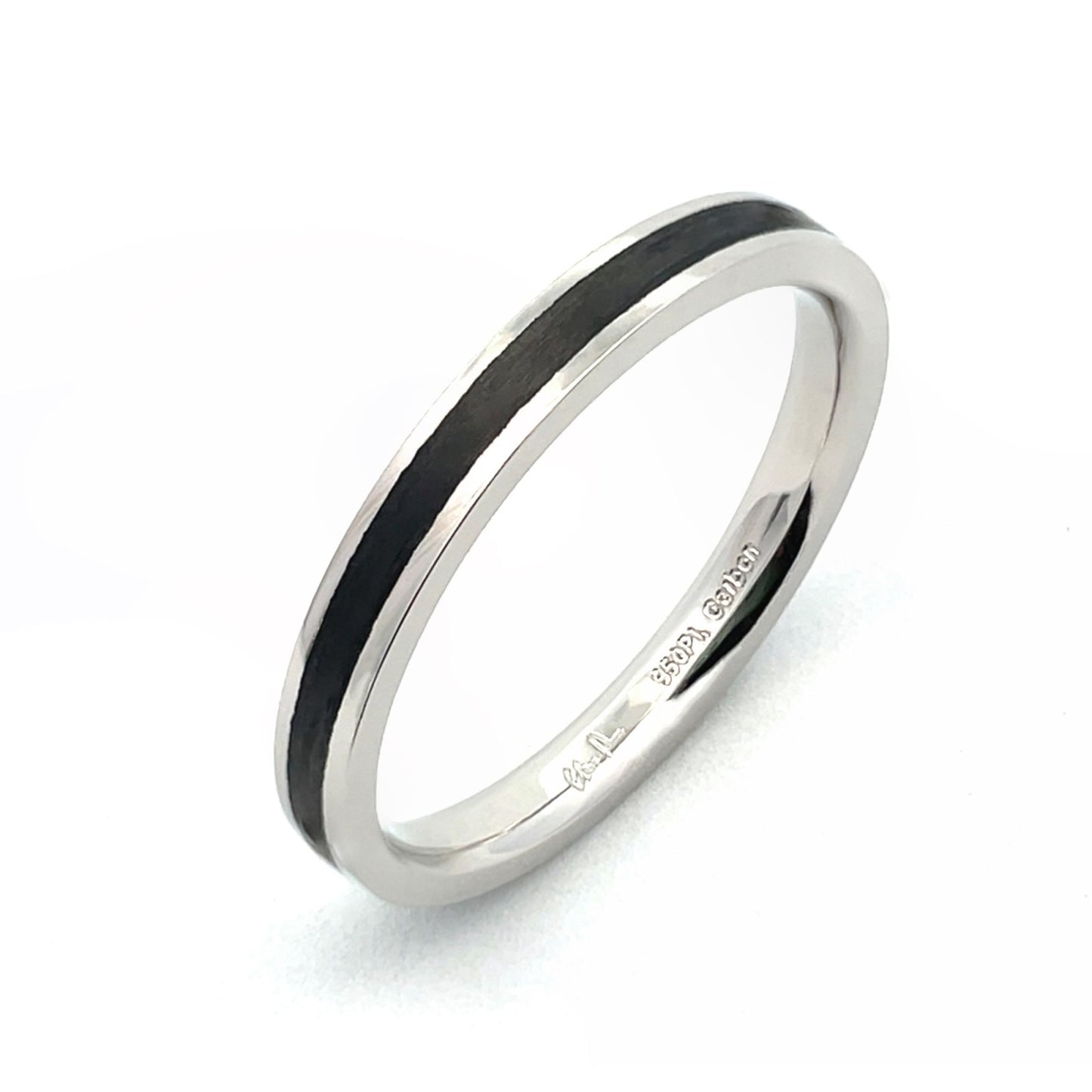 White gold ring with a black carbon fiber inlay on a white background.