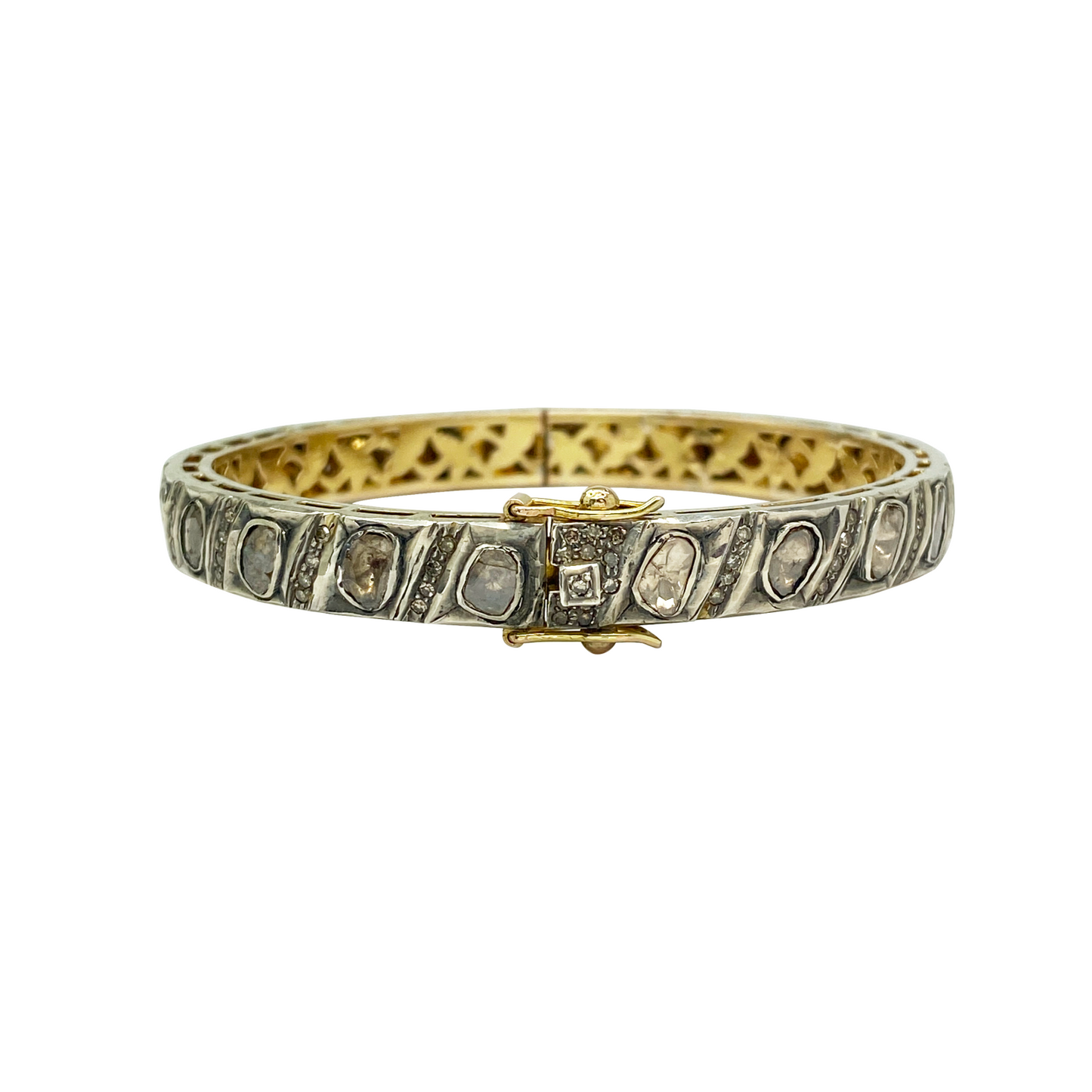Gold bracelet with embedded stones on a white background