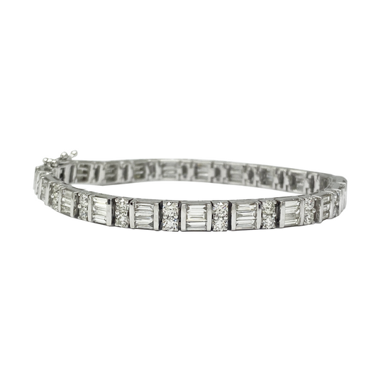 Diamond bracelet with baguette and round cut stones on a white background
