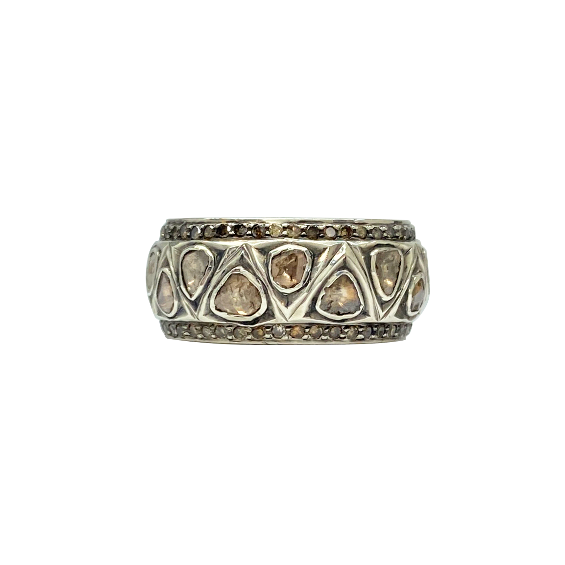 Silver ring with embedded stones on a white background