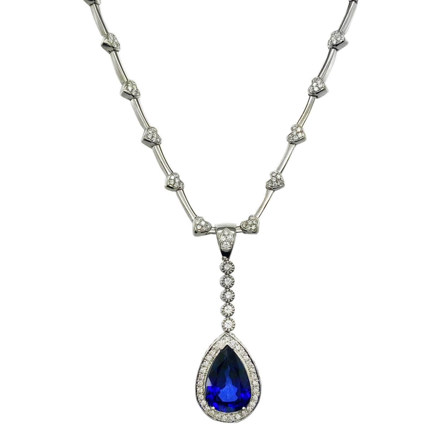 Necklace with a blue teardrop pendant and diamond accents on a white background