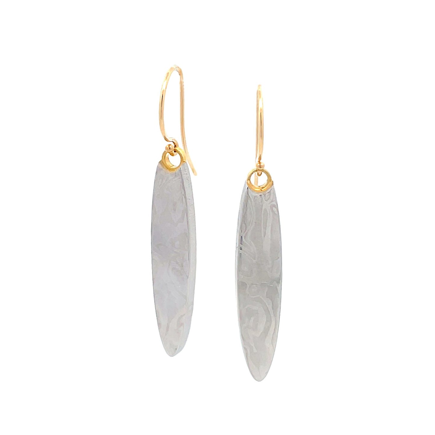 Pair of gold oval shaped earrings with a damascus steel pattern, on a white background.
