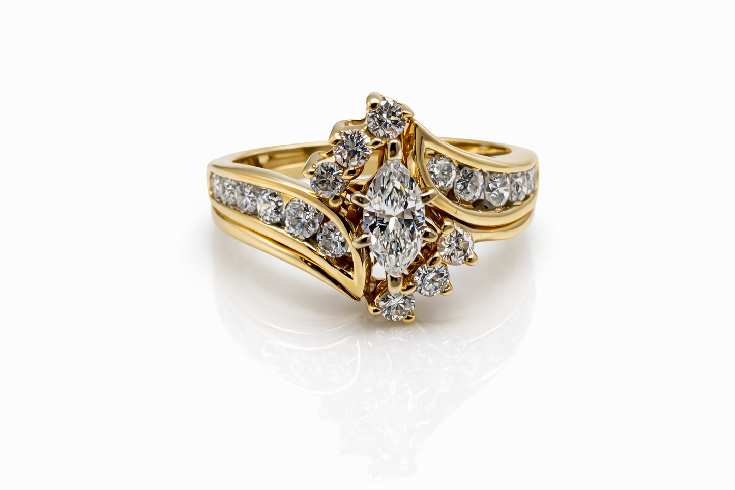 Gold ring with diamond accents on a white background