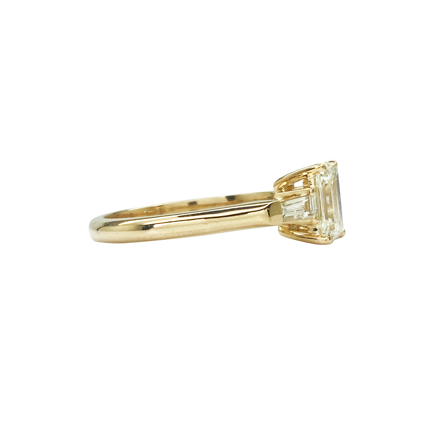 Gold ring with a diamond on a white background