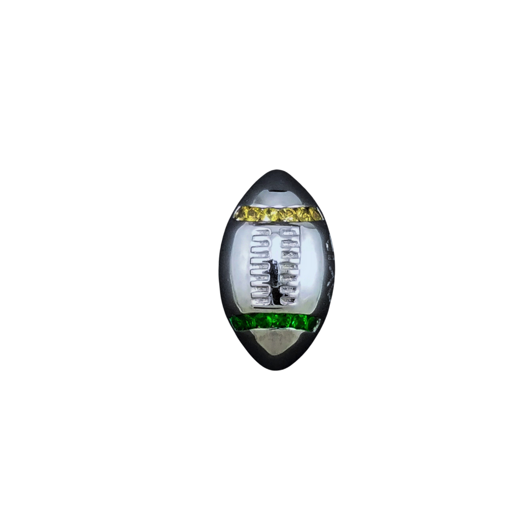 Silver magnetic pin football with gold and green accents on a white background