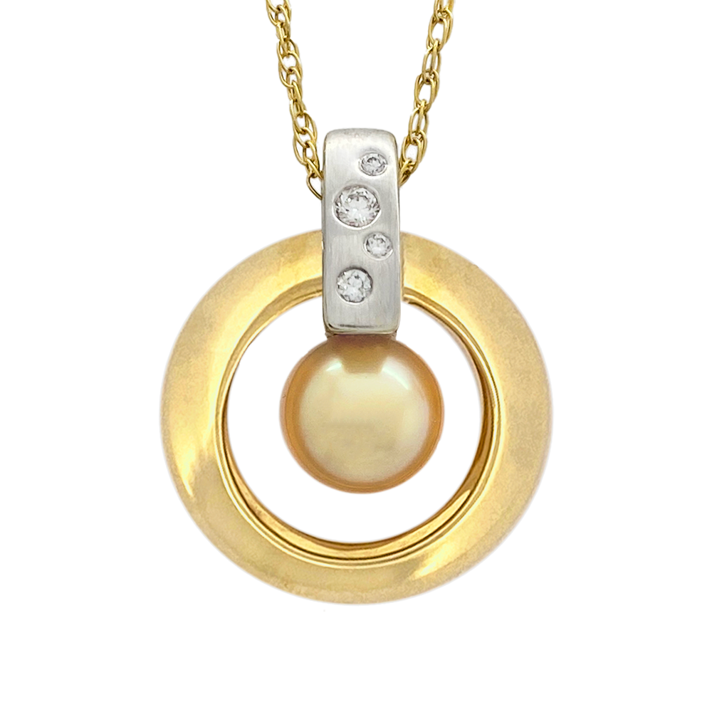 Two-tone gold pendant necklace with a cultured Akoya pearl in the center of a circular frame.