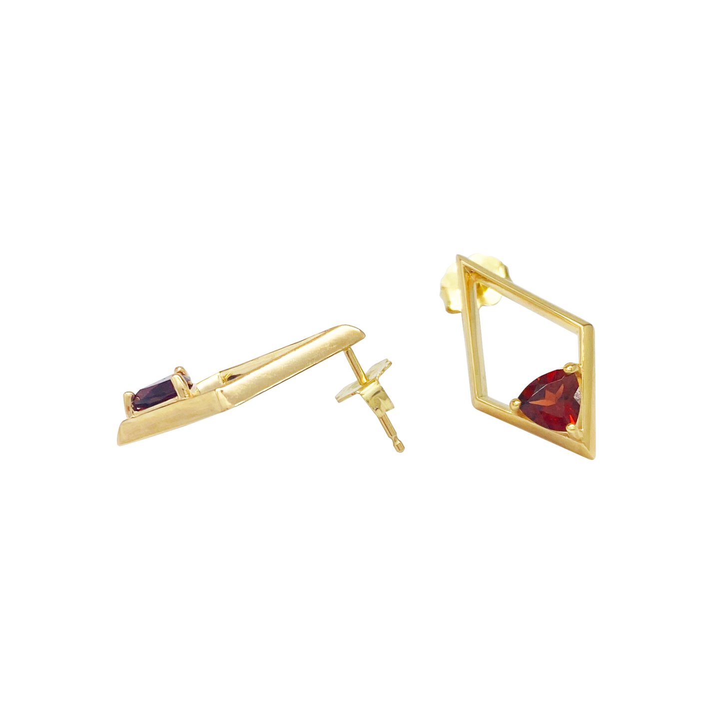 Gold earrings with gemstones on a white background