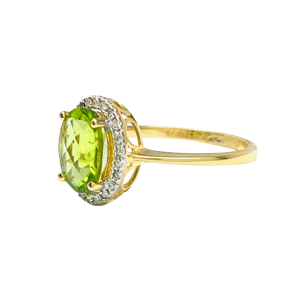 Gold Ring with a peridot in the center surrounded by diamonds