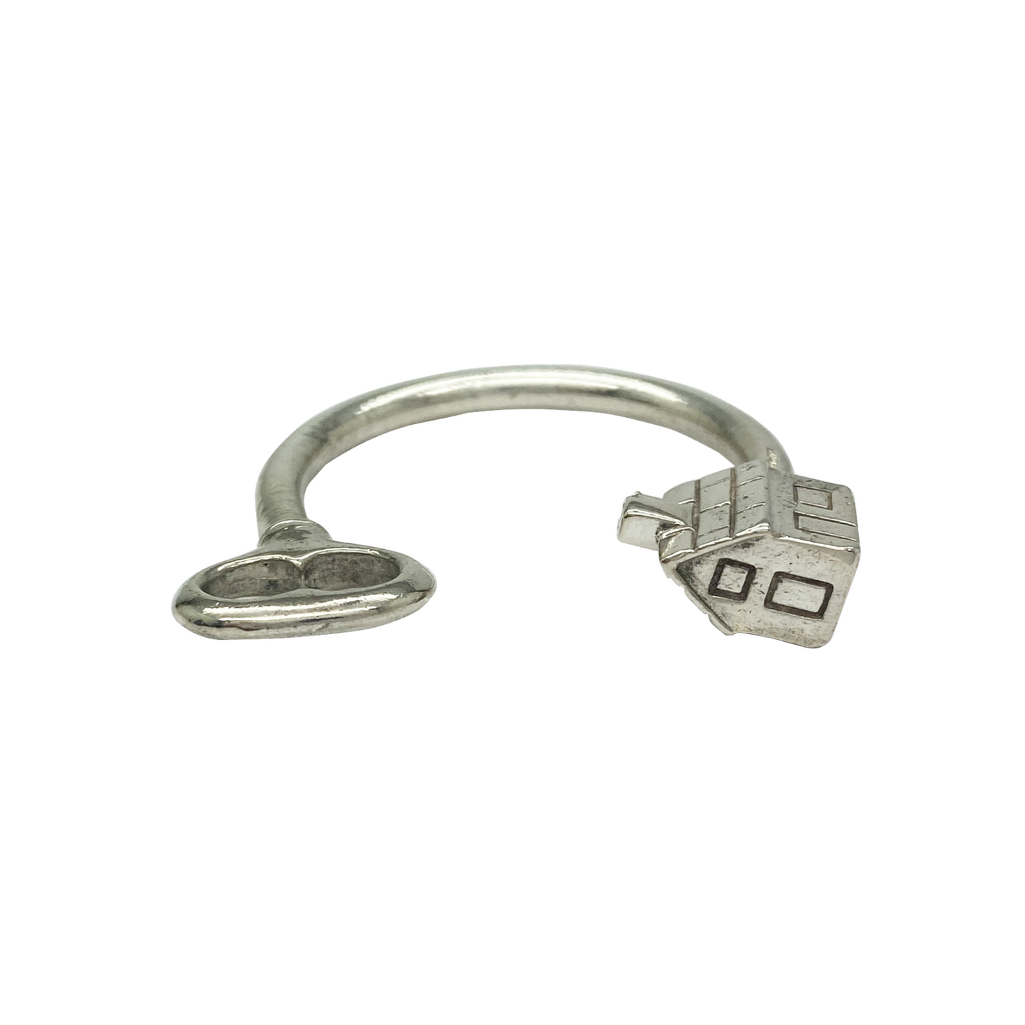 Silver keychain with house and key charms.