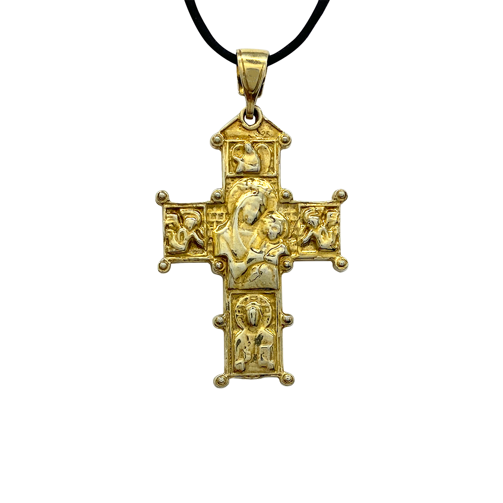 Gold cross pendant with intricate detailing of religious figures including the Virgin Mary
