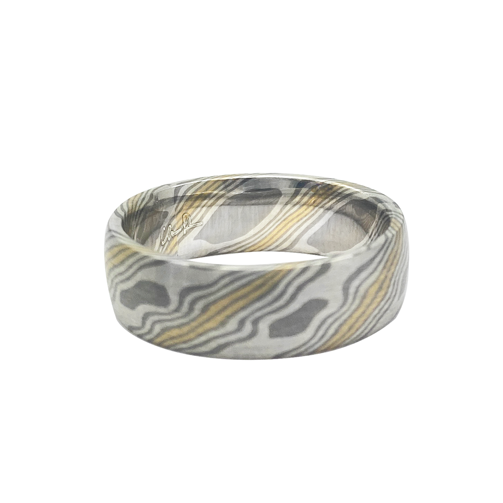 Silver ring with a Damascus steel pattern, on a white background.