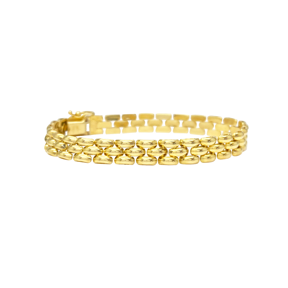 Yellow gold bracelet with a geometric pattern on a white background.