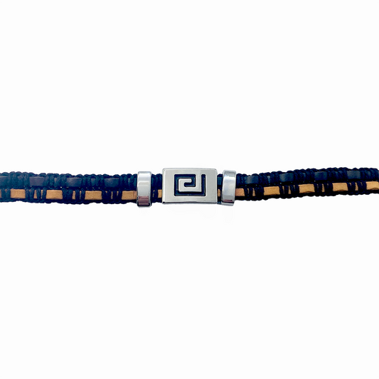 Leather bracelet with black and brown leather straps and a silver Greek key charm on a white background.