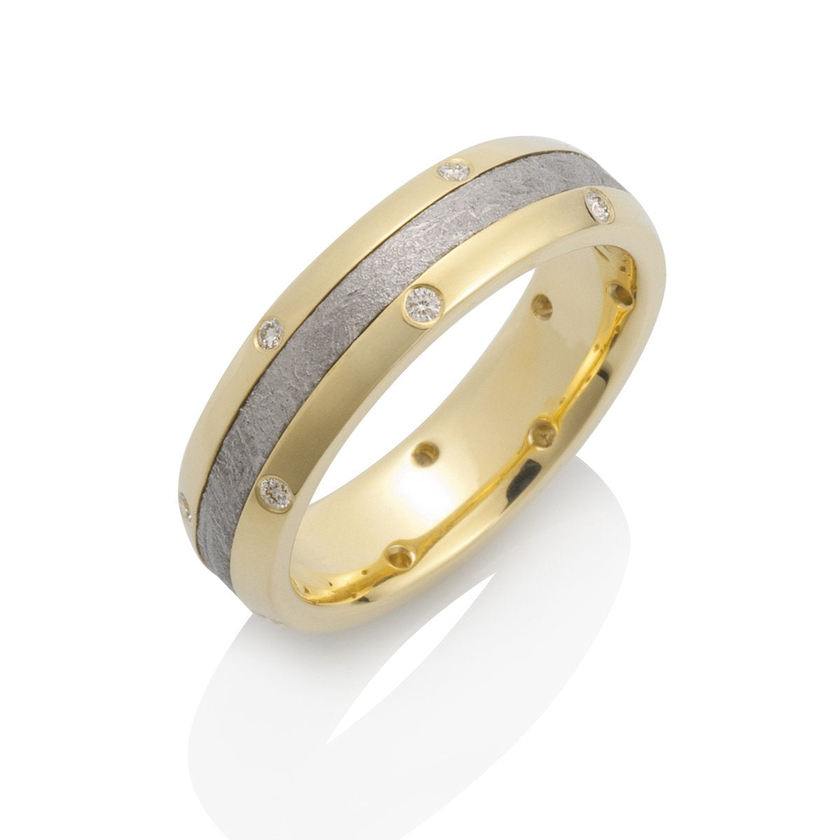 Yellow gold ring with a meteorite inlay and diamond accents on a white background.