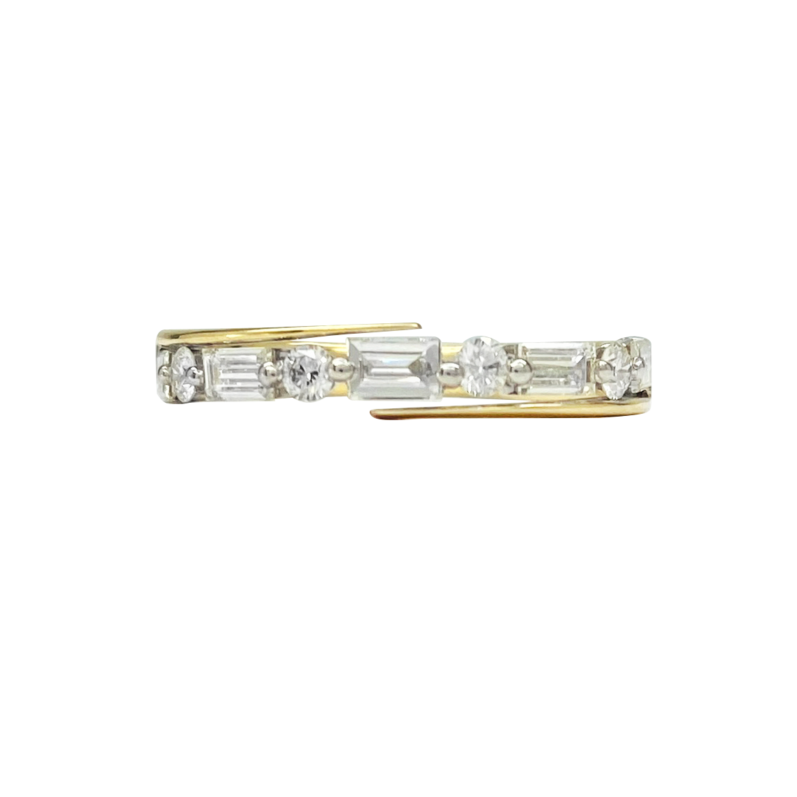 Gold ring with a variety of diamond cuts set horizontally across the band, including baguette, round, and oval shapes. The ring is photographed on a white background.