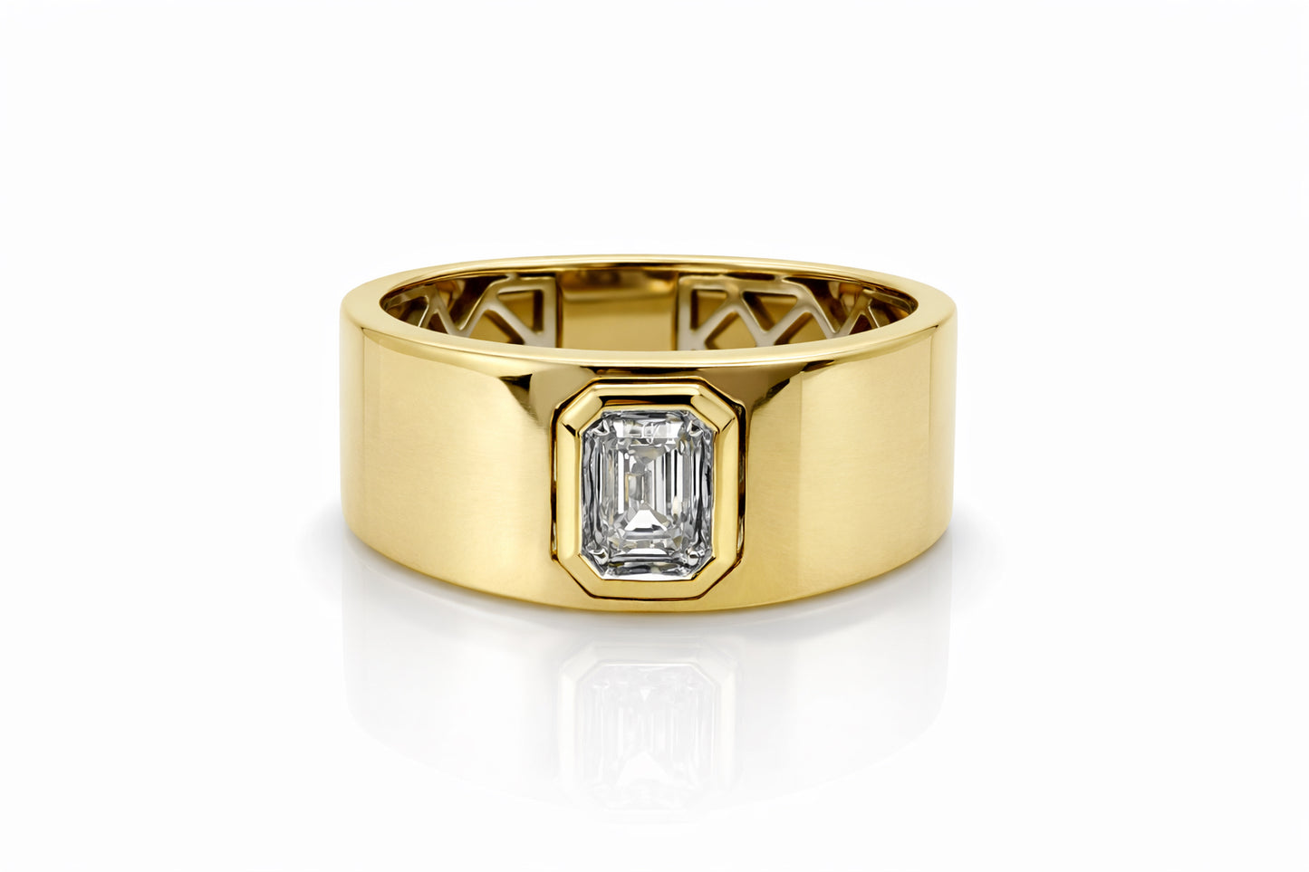 Gold ring with a diamond on a white background