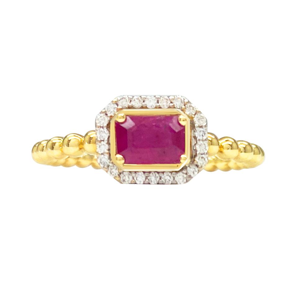 Gold ring with a square-shaped emerald stone set in a diamond halo, surrounded by a beaded band. The background is white.