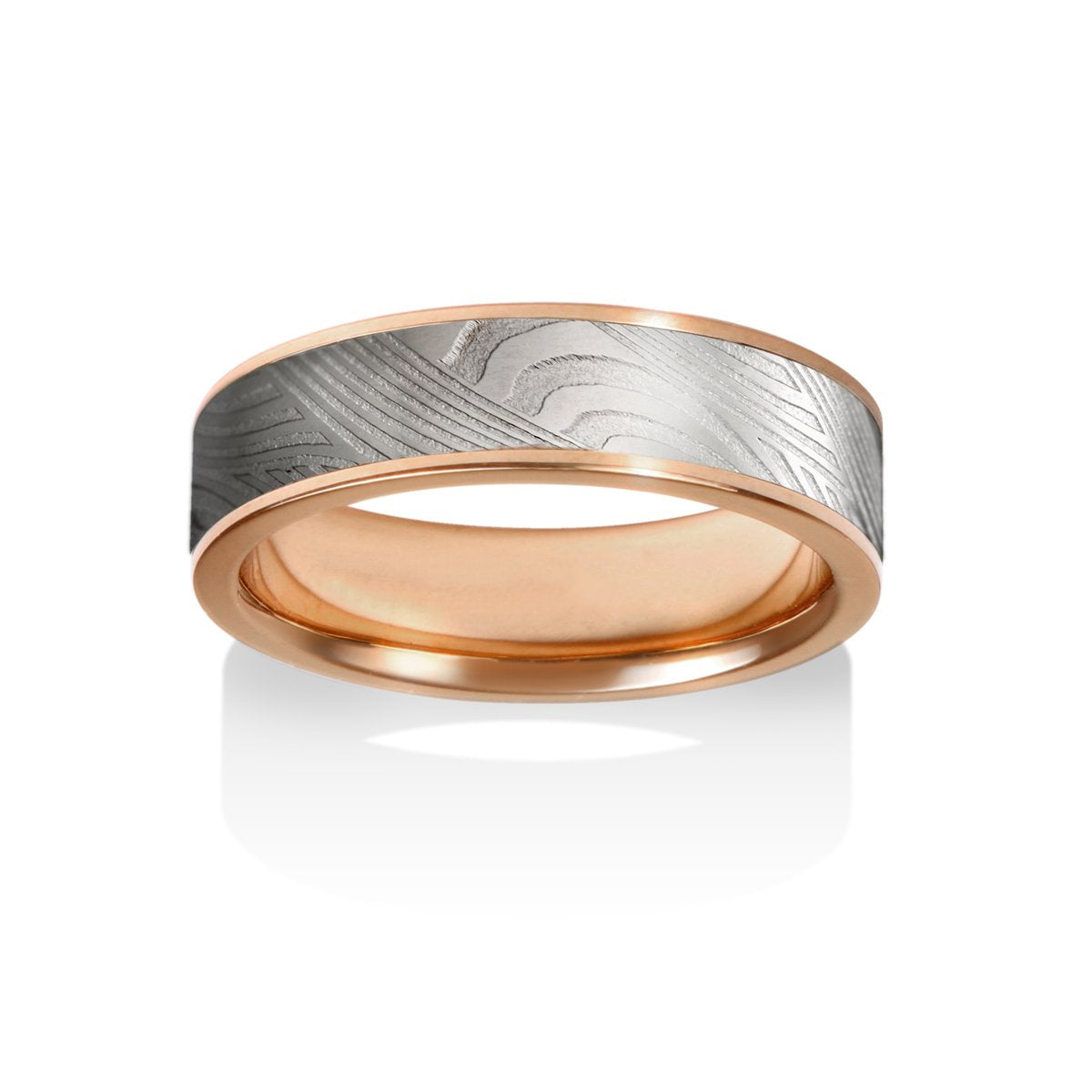 Rose gold with a textured, patterned center on a white background.