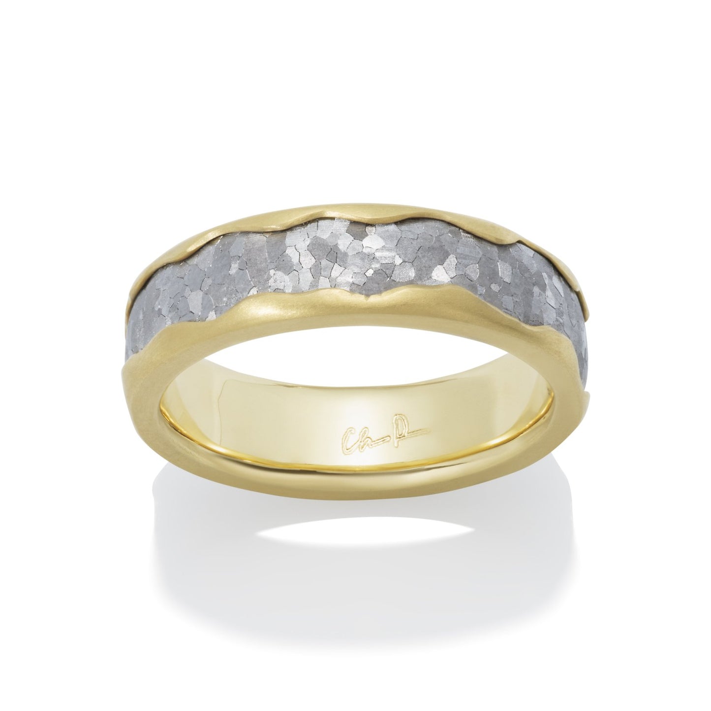 Two-tone gold wedding band with a textured silver center on a white background.