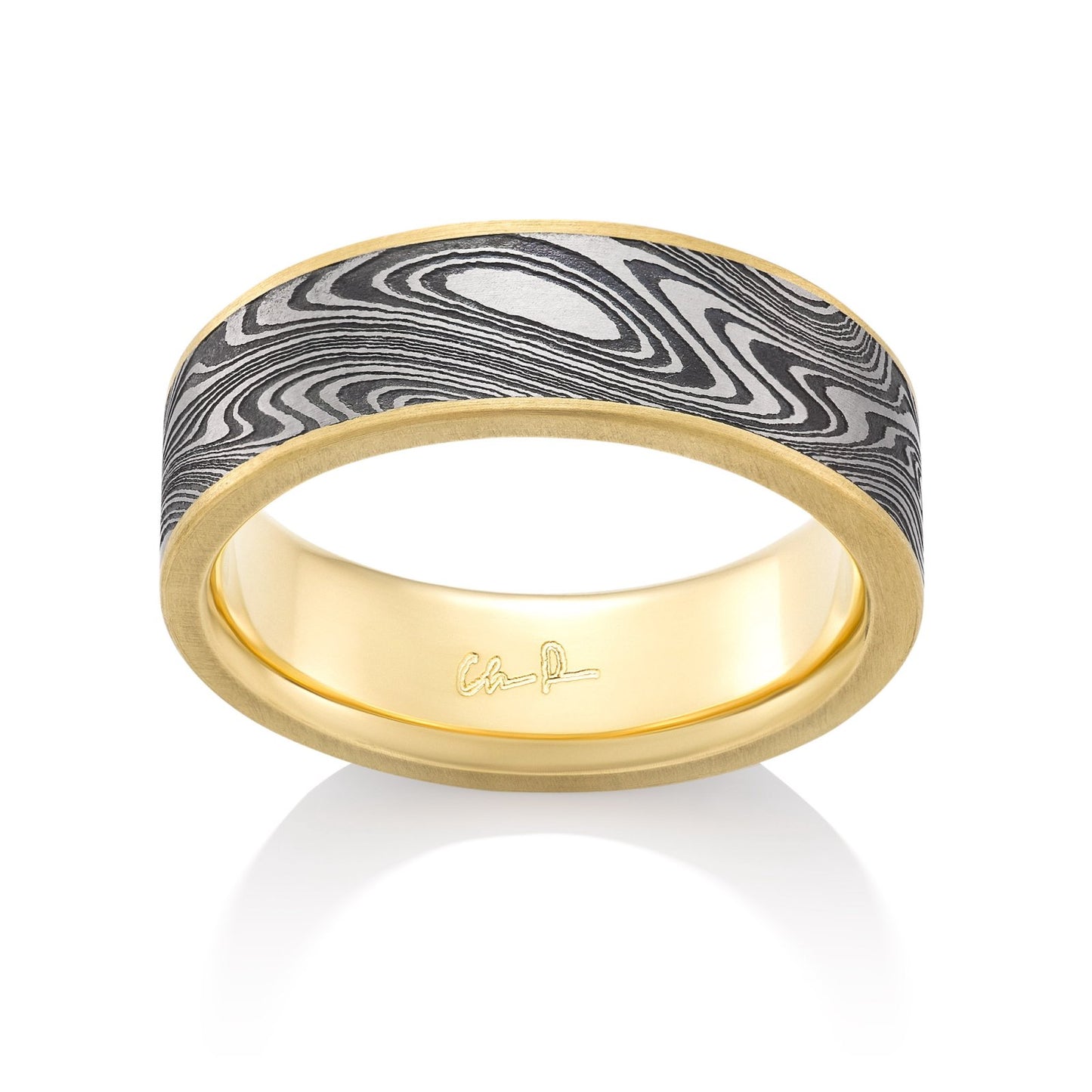 Yellow gold ring with a Damascus steel inlay on a white background.