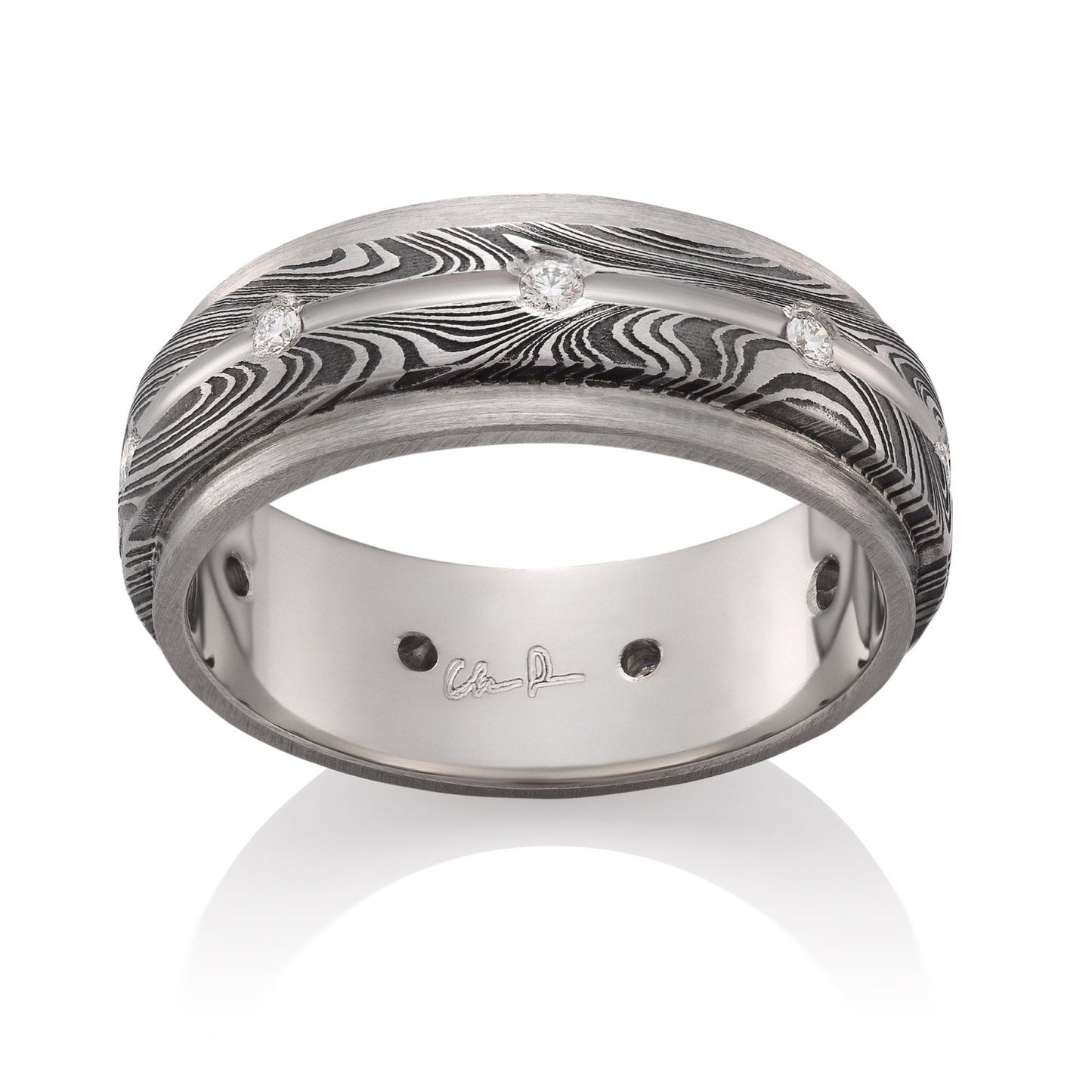 Stainless steel ring with a Damascus steel pattern and diamond accents on a white background.