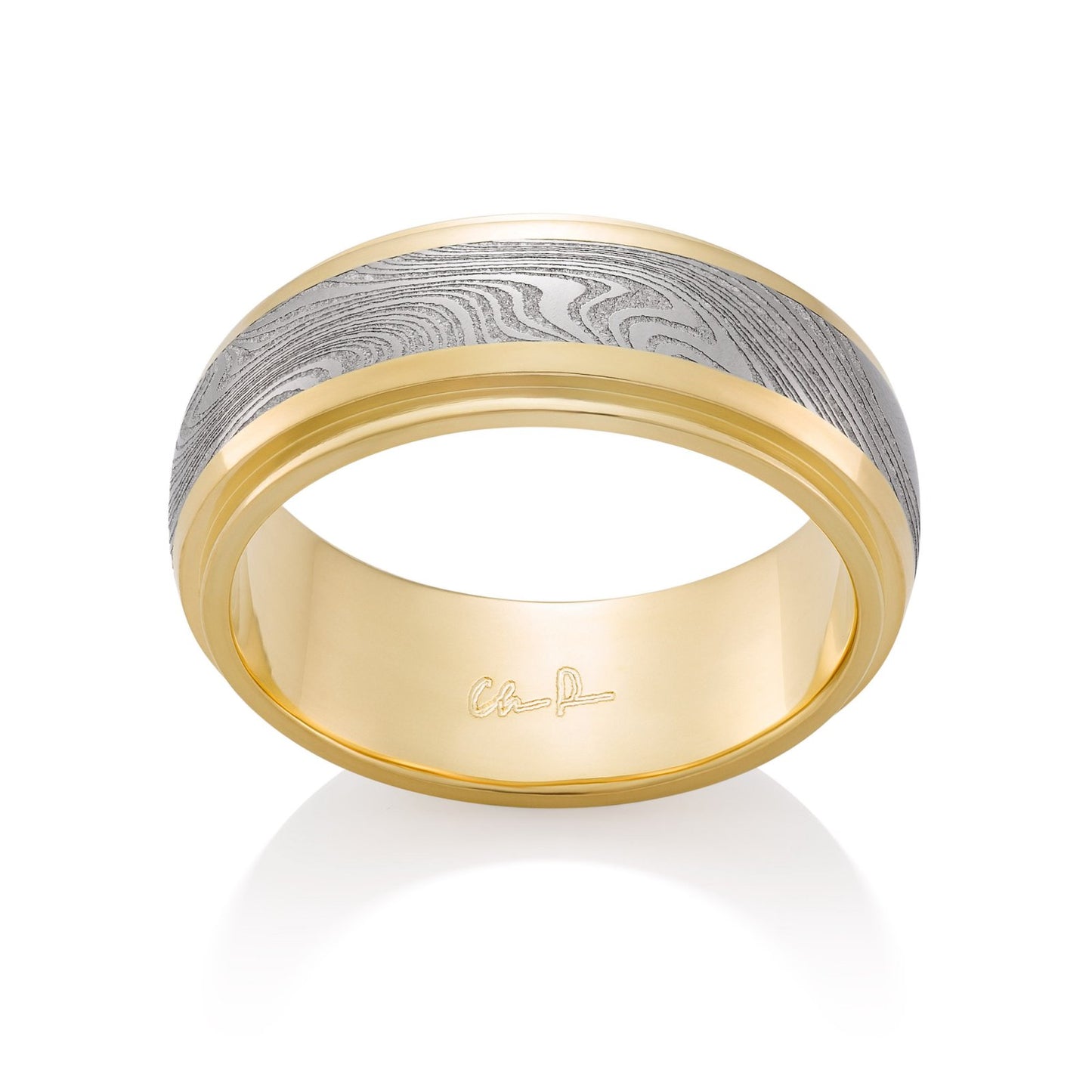 Yellow gold ring with a Damascus steel inlay on a white background.