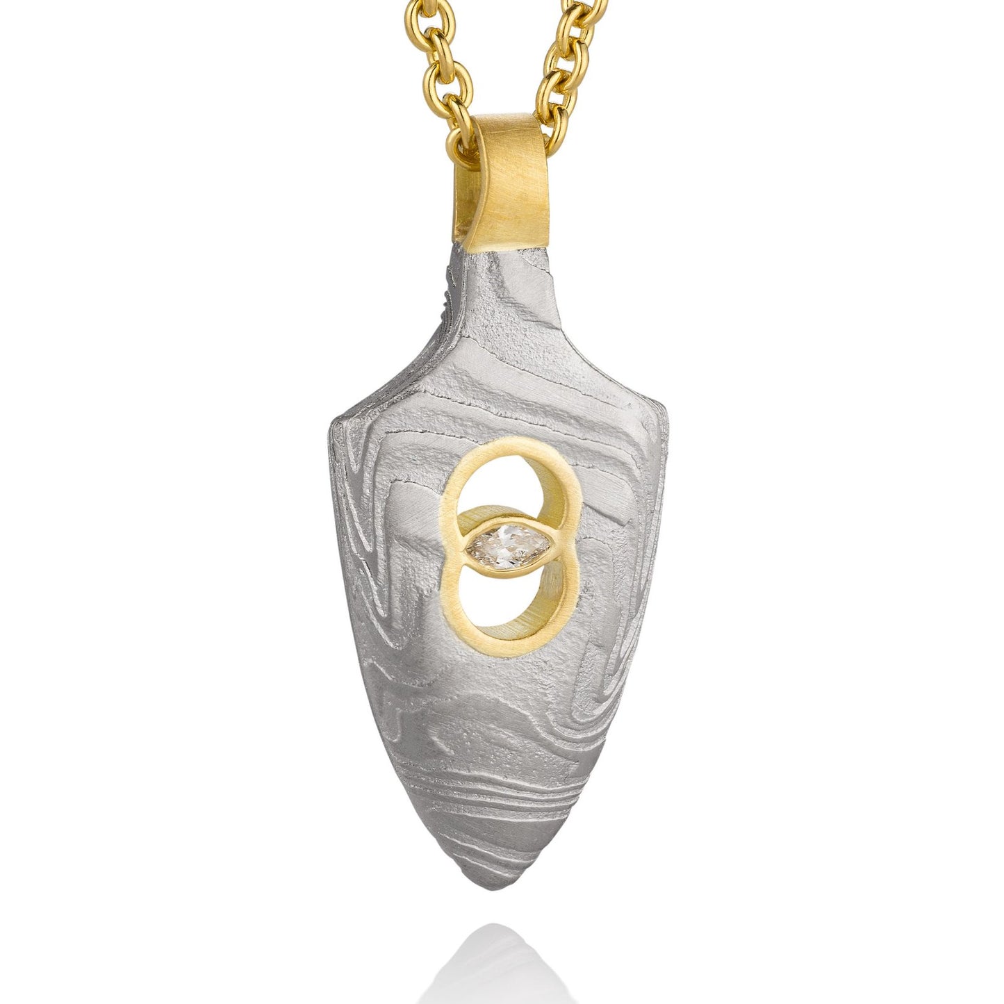 Gold shield-shaped Damascus necklace on a white background.
