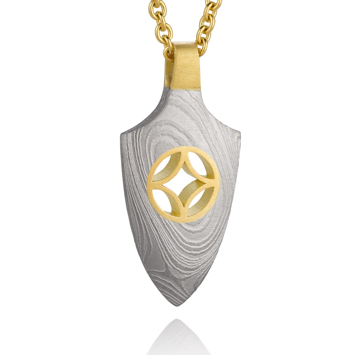 Gold shield-shaped Damascus necklace on a white background.