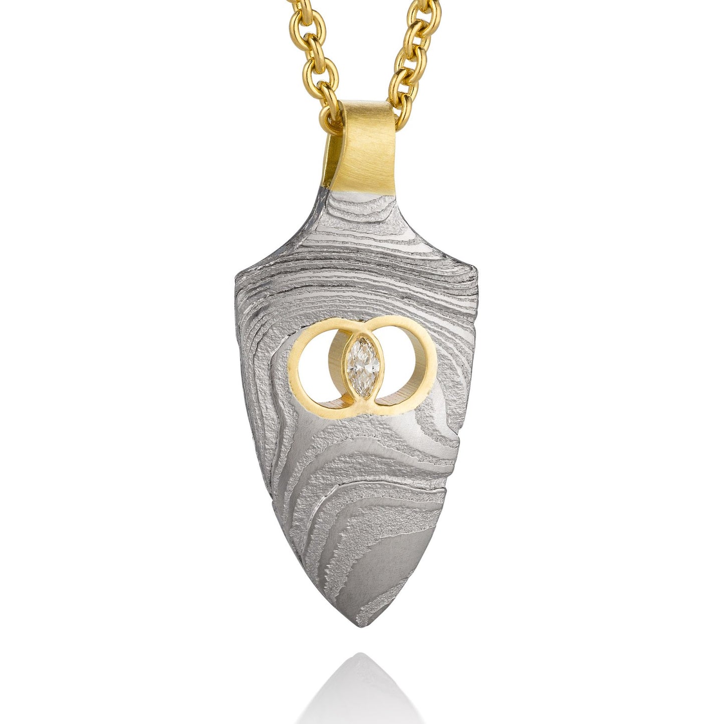 Gold shield-shaped Damascus necklace on a white background.